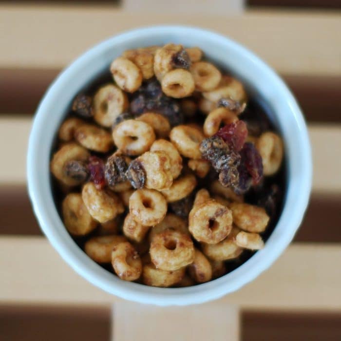 This Cranberry-Chocolate Peanut Butter Trail Mix Recipe is the perfect healthy travel snack for all ages! Full recipe at JessicaLevinson.com #healthytrailmixrecipe #healthytravelsnacks #peanutbuttertrailmix Overhead Peanut Butter Trail Mix Recipe in Dish