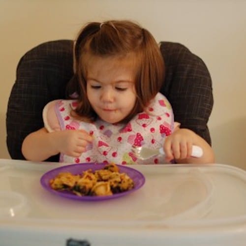 Creamy sweetpotato puree and garlicky black beans and spinach make a sweet and savory filling for gluten-free, vegetarian quesadillas. Recipe via JessicaLevinson.com #Sweetpotatoquesadillas #BlackBeanQuesadillaRecipe Toddler Eating Sweet Potato Black Bean Quesadillas