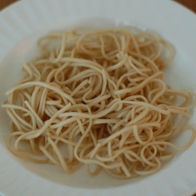 Long noodles signify longevity in Asian countries. Try this Chicken Vegetable Udon Soup to bring in the New Year with this delicious new challenge. Get the dairy-free recipe via JessicaLevinson.com | #udonnoodlesoup #chickesouprecipe #dairyfreesoups Chicken Vegetable Udon Soup Noodles in Bowl