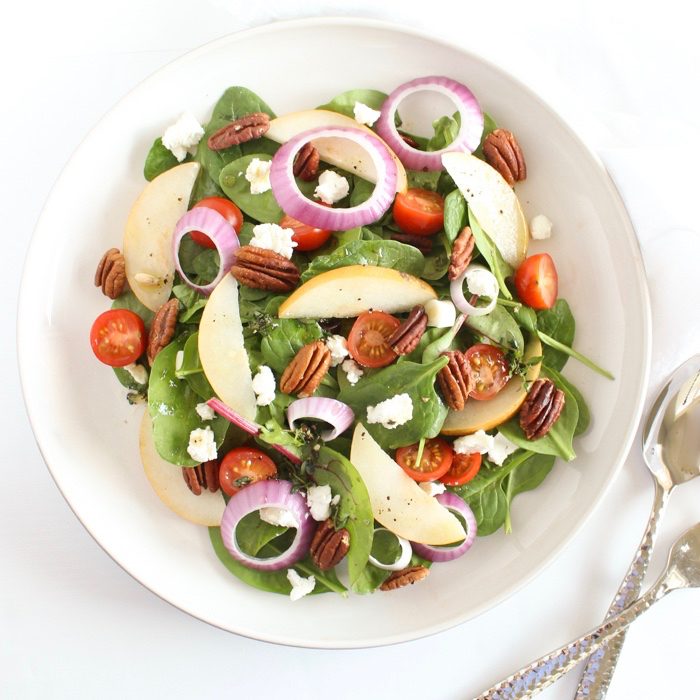 Spinach Pear Salad with Goat Cheese and Lemon Thyme Vinaigrette @ Jessica Levinson, MS, RDN, CDN Spinach Pear Salad with Goat Cheese and Lemon Thyme Vinaigrette | There's nothing boring about this flavor-packed salad! A bed of baby spinach is topped with crisp pears, juicy tomatoes, crunchy red onions and pecans, and creamy goat cheese, and tossed in a bright and aromatic lemon thyme vinaigrette. Get the gluten-free, vegetarian recipe @jlevinsonrd.