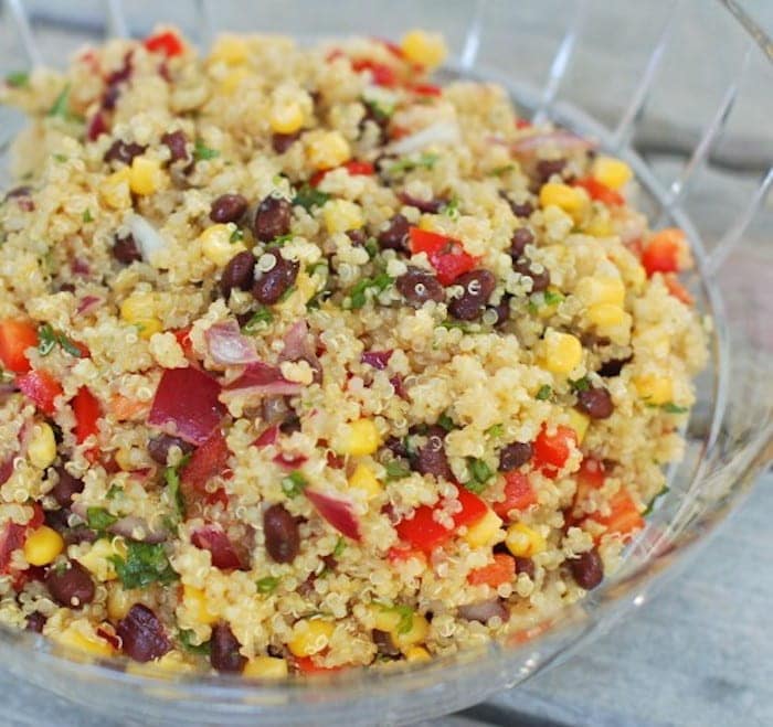 Corn and Black Bean Quinoa Salad | Corn and black beans join quinoa in a light, summery salad that's great as a side dish or for lunch on it's own. Perfect for barbecue season and Cinco de Mayo celebrations. Get the gluten-free, vegetarian, and vegan-friendly recipe via JessicaLevinson.com #healthyquinoasalad #summerquinoasalad Corn and Black Bean Quinoa Salad Close Up