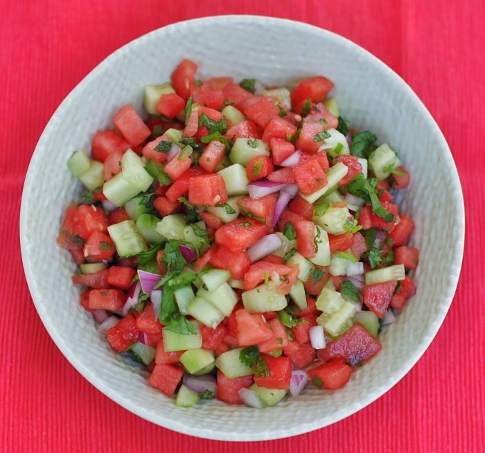 Flavorful and refreshing watermelon salsa is a fun summer twist on a classic. Serve with chips, over fish or beef tacos, on top of salads, or with grilled chicken. Get the gluten-free and vegan recipe at JessicaLevinson.com #WatermelonSalsaRecipe #SummerSalsa #SummerRecipes Watermelon Salsa in White Bowl Overhead