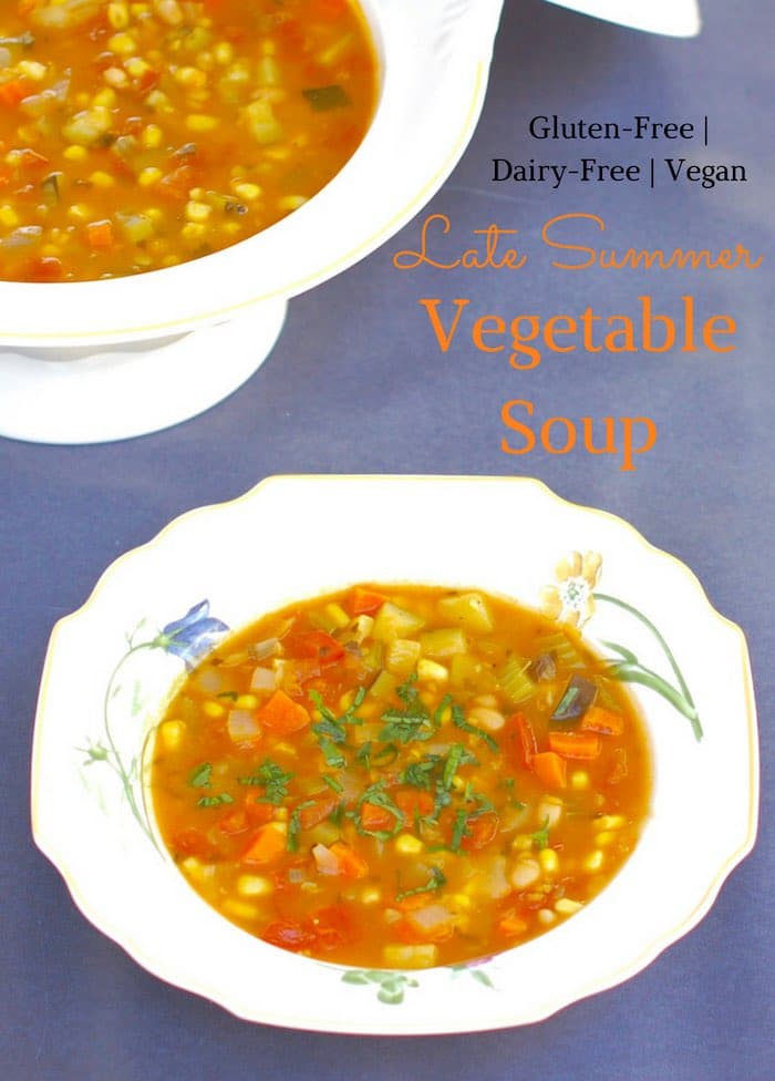 Use the last of summer’s bounty of zucchini, tomatoes, and corn to make this hearty vegetable soup brimming with flavor and nutrition. Vegan, Vegetarian, Gluten-Free, and Dairy-Free. Recipe @jlevinsonrd #summersoup #summervegetables Late Summer Vegetable Soup with Text