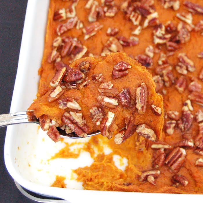 Lighten up a Thanksgiving classic with this naturally sweet and creamy Sweet Potato Carrot Casserole that's full of flavor and nutrition. #vegan #glutenfree #dairyfree #fallrecipes Close Up of Lightened Up Sweet Potato Carrot Casserole