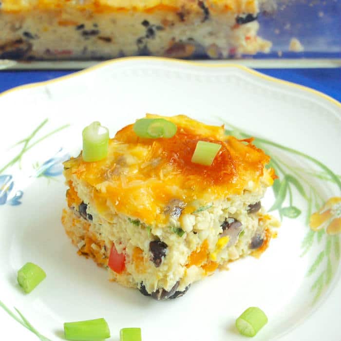 Feed your hungry family in an hour with this one-dish Southwestern Cauliflower Rice Casserole packed with veggies, protein, and flavor! Get the gluten-free, grain-free, and vegetarian recipe via JessicaLevinson.com #CauliflowerRiceCasserole #GrainFreeDinner Southwestern Cauliflower Rice Casserole Recipe Closeup