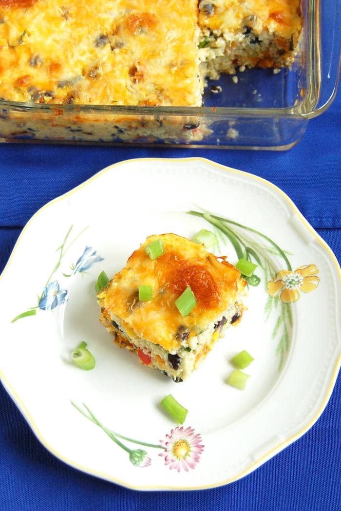 Feed your hungry family in an hour with this one-dish Southwestern Cauliflower Rice Casserole packed with veggies, protein, and flavor! Get the gluten-free, grain-free, and vegetarian recipe via JessicaLevinson.com #CauliflowerRiceCasserole #GrainFreeDinner Southwestern Cauliflower Rice Casserole Recipe on Plate
