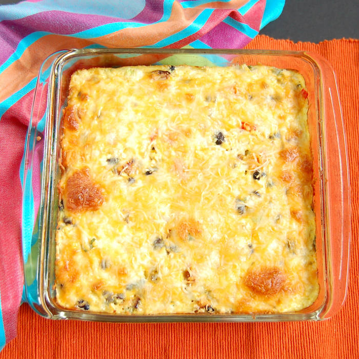 Feed your hungry family in an hour with this one-dish Southwestern Cauliflower Rice Casserole packed with veggies, protein, and flavor! Get the gluten-free, grain-free, and vegetarian recipe via JessicaLevinson.com #CauliflowerRiceCasserole #GrainFreeDinner Southwestern Cauliflower Rice Casserole Overhead