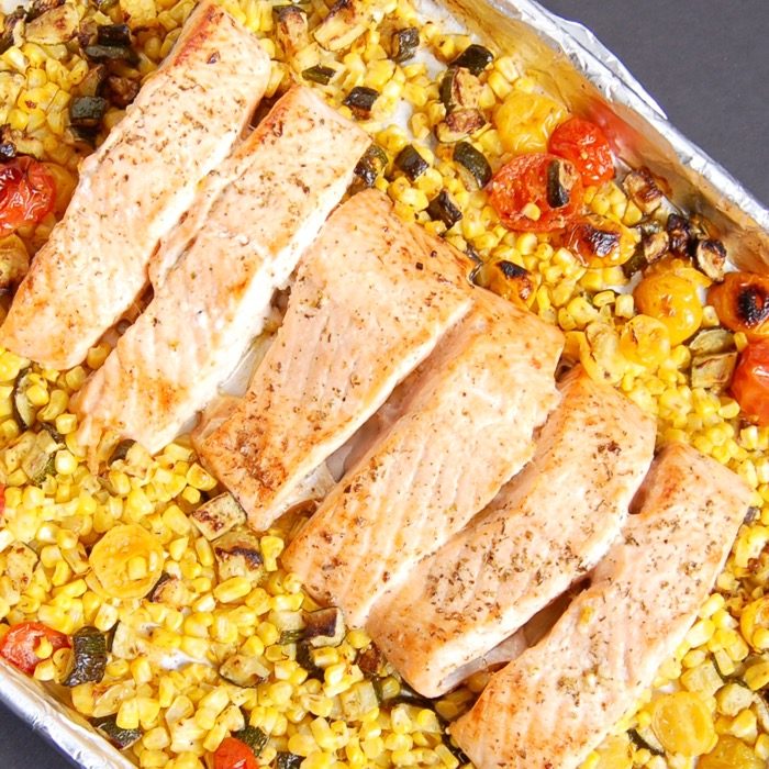 Mediterranean Sheet Pan Salmon with Zucchini, Corn, and Tomatoes | Jessica Levinson, MS, RDN, CDN Mediterranean Sheet Pan Salmon with Zucchini, Corn, and Tomatoes is quick and easy to make and clean up. A perfect weeknight dinner for busy families. Get the recipe at JessicaLevinson.com | #glutenfree #dairyfree #eggfree #nutfree #salmon #recipe #sheetpanmeal #sheetpandinner #zucchini #corn #tomatoes #summerrecipes #summerveggies