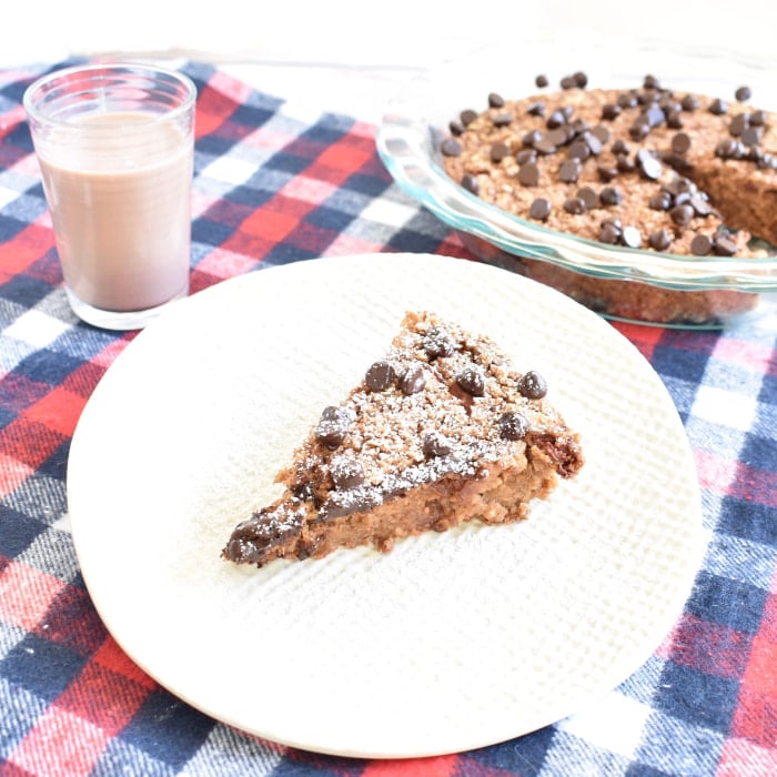 Chocolate Baked Oatmeal with Berries and glass of chocolate almondmilk Baked Oatmeal with Berries and glass of chocolate almondmilk