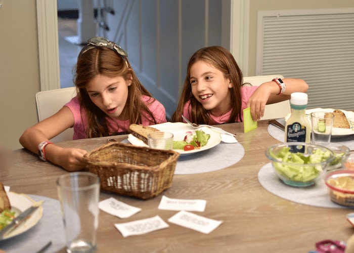 My daughters at family dinner children sitting at family dinner